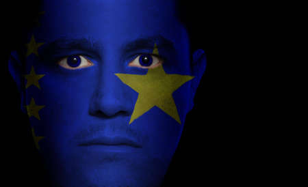 Congolese flag painted/projected onto a man's face