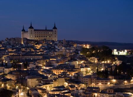 View of Toledo, Spain including the Alcazar at nightの写真素材