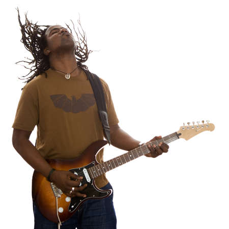 African adult male with dreadlocks flying jamming on a guitar on a white background.の写真素材
