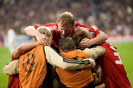 MADRID - FEB. 25, 2009: Liverpool players including Sami Hyypia, Steven Gerrard, Dirk Kuyt and Martin Skrtel celebrate Yossi Benayoun's winning goal during their Champions League second round match against Real Madrid.のeditorial素材
