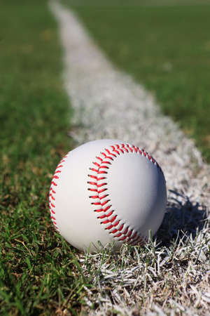 Close-up of a baseball on the outfield foul line.の写真素材