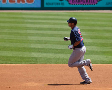 JUPITER, FL USA - Mar. 24, 2010: Red Sox catcher Jared Saltalamacchia rounds the bases after hitting a solo home run during the Boston Red Sox vs. Florida Marlins spring training game.のeditorial素材