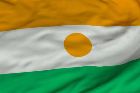 Detailed 3D rendering closeup of the flag of Niger.  Flag has a detailed realistic fabric texture and an accurate design and colors.の写真素材