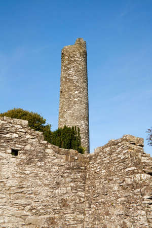 Historic ruins of the watch round tower at Monasterboice, early monastic settlement in Ireland. の写真素材