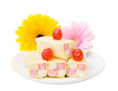 Tasty cakes with cherries and flowers. Isolated over white background.の写真素材