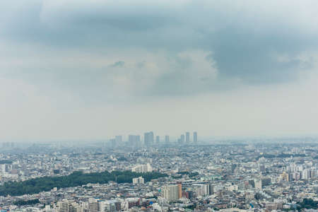 Tokyo's cityscape in the rainy season skyの写真素材