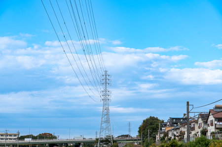 Scenery with electric wire towersの写真素材