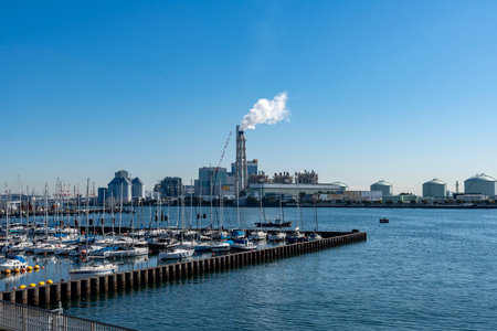 Yokohama City, Kanagawa Prefecture Scenery of Yacht Harbor and Thermal Power Plantの写真素材