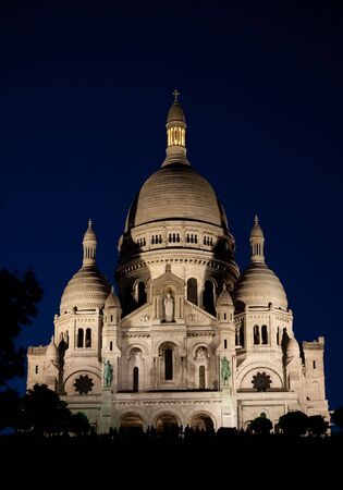 Sacre Coeur temple in Montmatre, Paris, at nightの写真素材