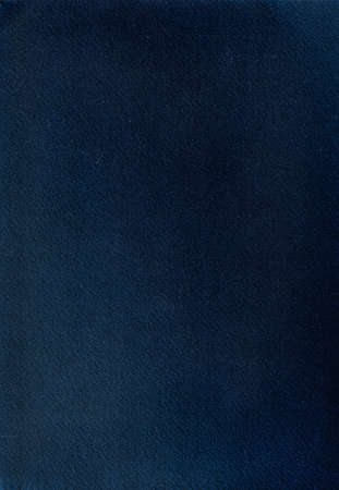 Deep blue cotton paper texture with dust, lint and debris. Colored cotton paper with light glare.の写真素材