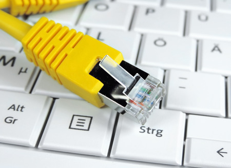 yellow cable and white laptop.