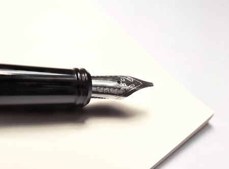 fountain pen and antique paper