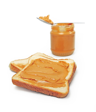 Peanut butter and toast, isolated on whiteの写真素材