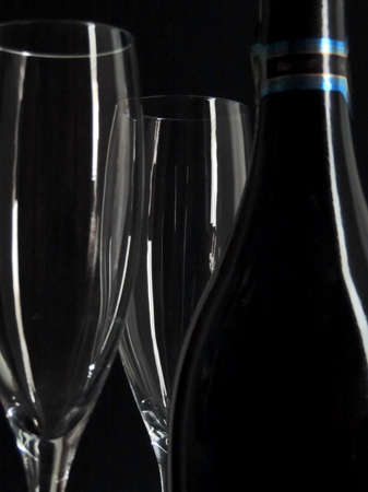 Champagne bottle and glasses, isolated on blackの写真素材