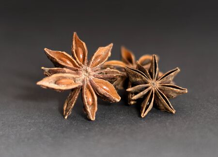 Close-up of christmas spices. Cinnamon, star anise and Pepper on black underground.