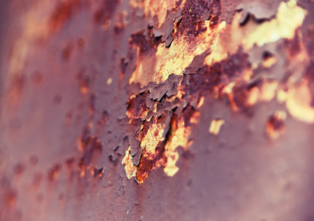 selective focus of a weathered, peeling background with rusty color.