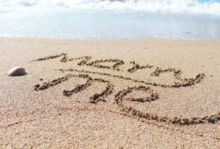Marry me text, written on the sand.の写真素材