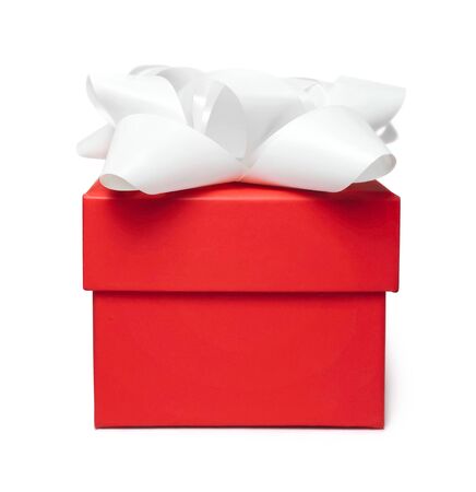 Red gift box with white bow, isolated on white.の写真素材