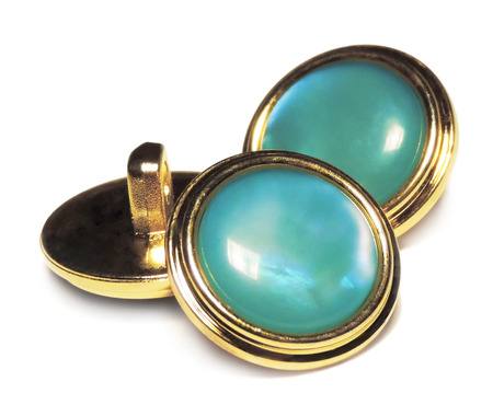 Elegant turquoise sewing buttons with gold. Isolated on white.
