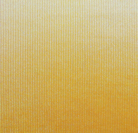 Golden satin textile or cloth, closeupの写真素材