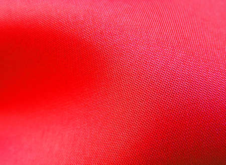 Wavy cloth or textile. Closeup of red texture.の写真素材