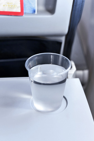 Glass of water, Flight scene.の写真素材