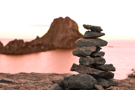 Stack rock or stone stack at Es Vedra, Ibiza Iceland. Tranquil scene at sunset.の写真素材