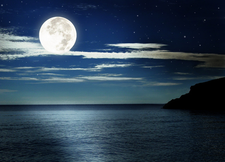 Full moon over the sea.の写真素材