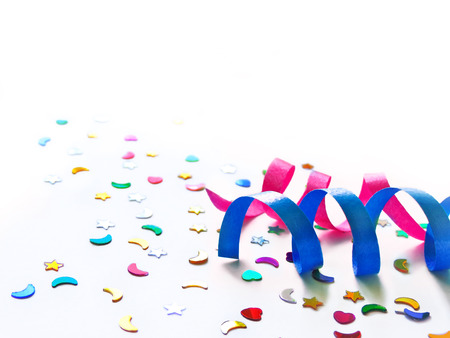 party decoration, curly ribbon and white background.の写真素材