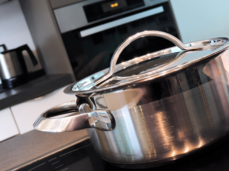 Cooking pot on a glass ceramic stove top.