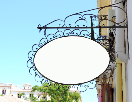 Old, ornate shop signboard, blank sign with copyspace.の写真素材