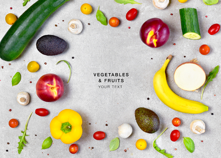 Delicious fresh fruits and vegetables on a stone background. Top view with copy space.の写真素材