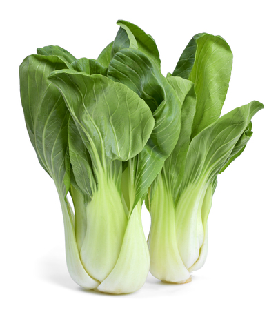 Fresh pak choi cabbage or chinese cabbage, isolated on white background. Fresh, green vegetable, close-up shot. Healthy lifestyle theme, kitchen scene.の写真素材