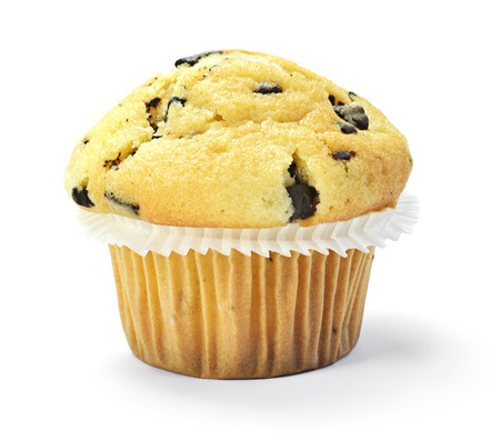 Delicious vanilla muffin with chocolate, isolated on white background. Muffin and paper, sweet food or unhealthy eating theme.の写真素材