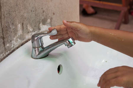 hand shut the faucet, water saving.の写真素材