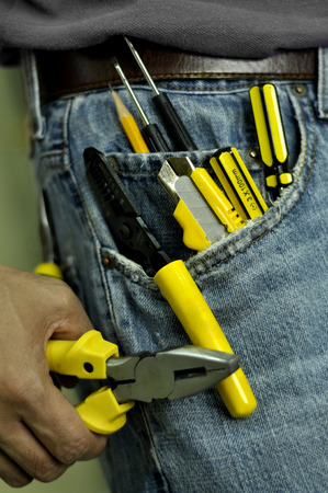 man holding handtools