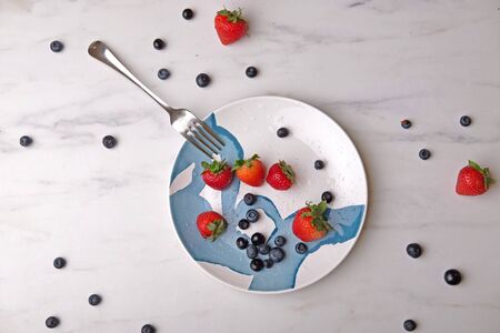 Strawberry and blueberry dessert on plateの写真素材