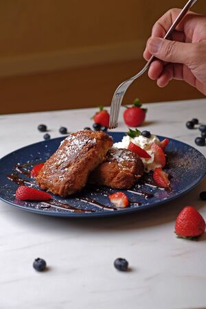 tasting strawberry pastry cakeの写真素材