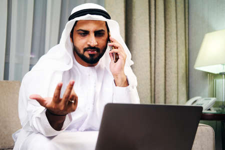 Middle Eastern Arab man wearing kandura dish dash. Arabic male on traditional clothingの写真素材