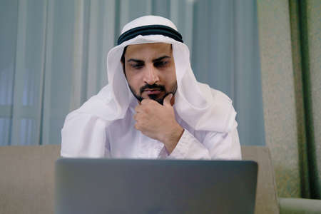 Middle Eastern Arab man wearing kandura dish dash. Arabic male on traditional clothingの写真素材