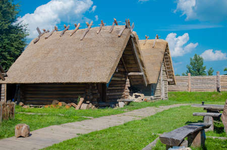 The old village. building under a reed roof. summertimeの写真素材