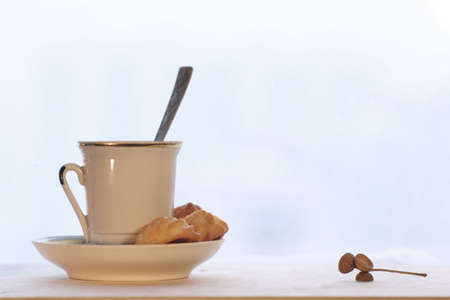 Morning coffee cup with cookie and acorn cap