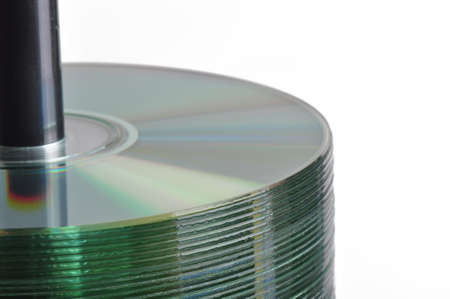 Stack of blank CD-r discs on a spindle with a white backgroundの写真素材