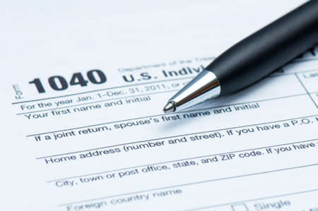 American tax form and closeup of executive style penの写真素材