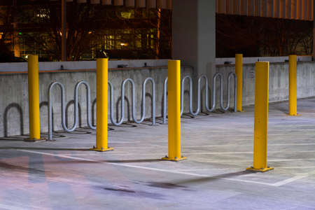 Automobile parking lot with special protected bike lock up areaの写真素材