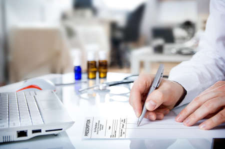 Doctor issues a prescriptionの写真素材