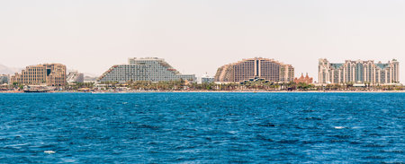Eilat, Israel - May 15, 2012: Seascape view from the Red sea on the famous hotels on Eilat beach,...