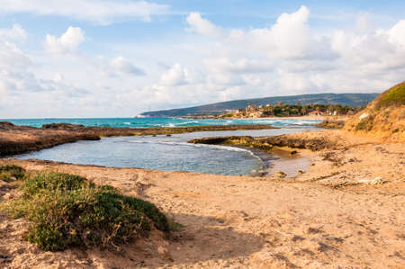 Wild beach with cliffs and rocks inside the Mediterranean Sea in North Israel near Rosh Hanikraの写真素材