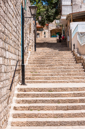 Safed, Israel - May 20, 2012: Rows of stone stairs in Old Town of Safed, highest city in Israelのeditorial素材