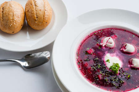 Beet soup with dumplings, sour cream and buns. Hot and tasty and most of all healthy.